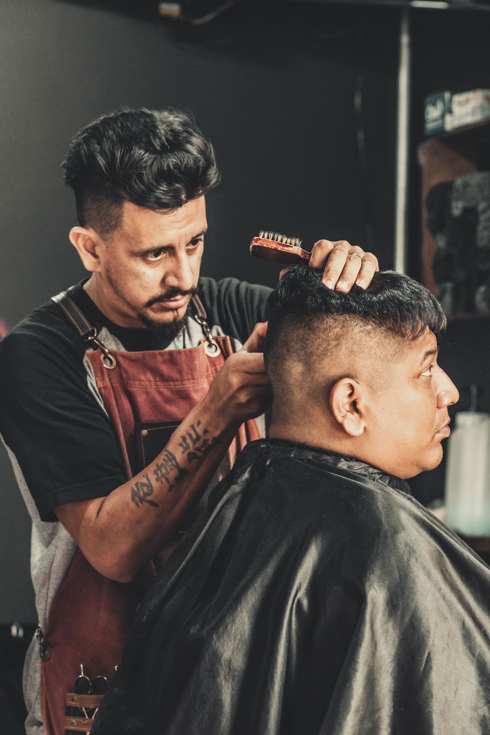Barber cutting a client's hair